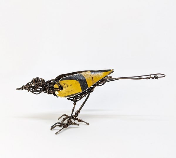 Small wire bird sculpture with tin wings